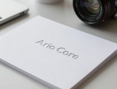 Professional photography of high-end corporate stationery featuring the Aero Core logo, embossed on premium arctic white paper, captured in a clean North American office setting with natural light.