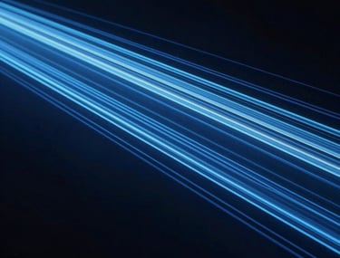 An abstract photograph representing data flow, with light trails in navy blue and light blue moving through a dark space, symbolizing high-impact analysis.