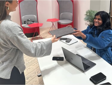 A resident hands over an unwanted laptop at a TTB CircularIT tech amnesty event