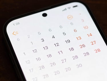 Macro photography of an Android phone screen showing a clean, high-contrast calendar interface. The lighting is crisp and emphasizes the sharp display quality.