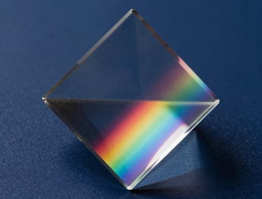 Abstract photography focusing on the refraction of light through a glass prism, creating soft rainbows on a navy surface, East Asian / Japanese style.