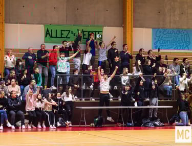 a group of people standing in front of a crowd of people
