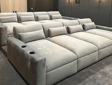 Velvet theater seating with cup holders and tiered rows by Solo Home Decor for home cinema.