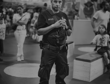 a man in a police uniform is holding a camera