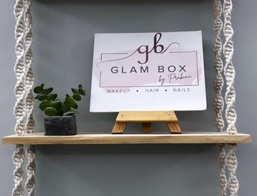 a shelf with a sign that says glambox