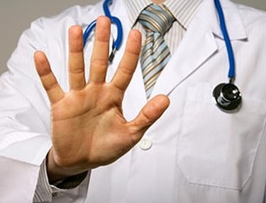 a doctor holding up his hands with a stethoscope, saying DO NOT NEED MEDICAL STUDIES