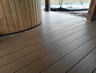 a wooden deck with a hot tub and a wooden deck