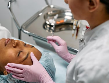 a woman in a white shirt and gloves is getting her face examined