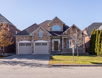 newly built residential home with two car garage