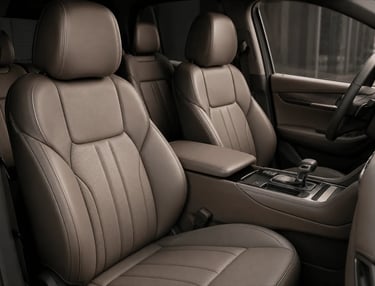 Luxurious brown leather car interior featuring premium front seats and center console.