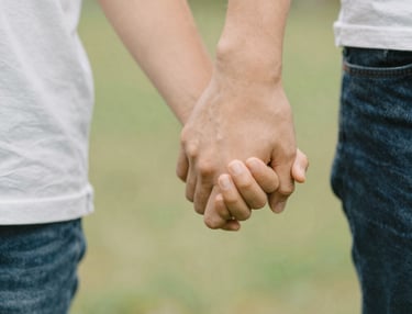 Outdoor scene of kids exploring a green garden with playful learning activities.