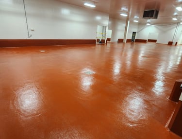Polyurethane cement flooring system for heavy-duty industrial environments dairy processing
