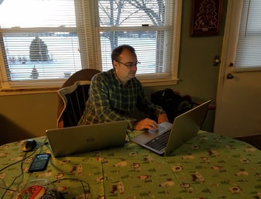 Tim Scott working on two laptops at the same time