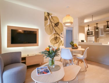 a living room with a table and chairs