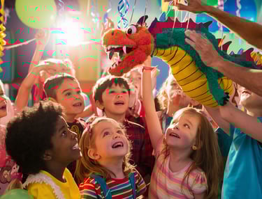 children at children's party with puppet presentation