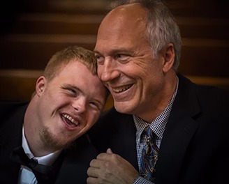 grandfather smiling with young grandson