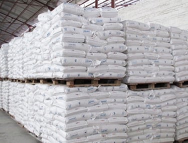 a pallet of bags of bags of ricepvc finished goods warehouse