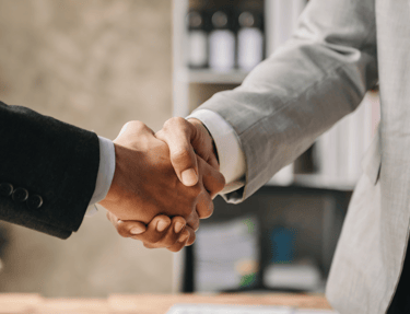 Executives are shaking hands