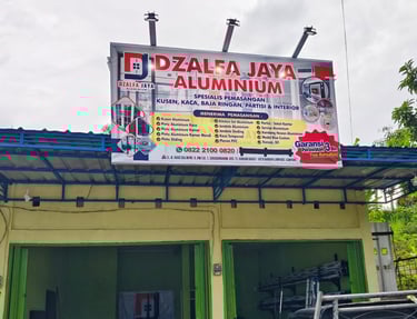 <img src="bengkel-aluminium.jpg" alt="Workshop Dzalfa Jaya Aluminium - Spesialis Pintu, Jendela, dan