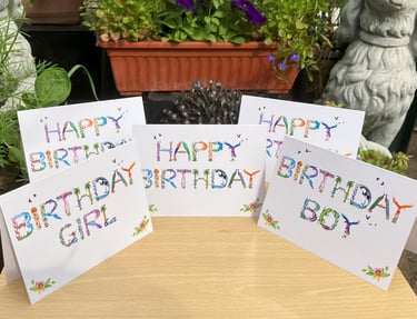 A range of birthday cards printed in tropical exotic wordart