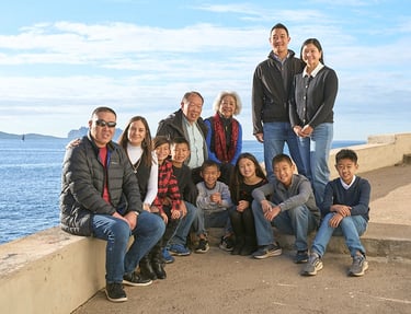 Family portrait along the Vieux Port of Marseille with seaside background