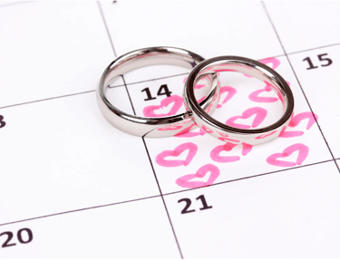 two wedding rings on a calendar calendar