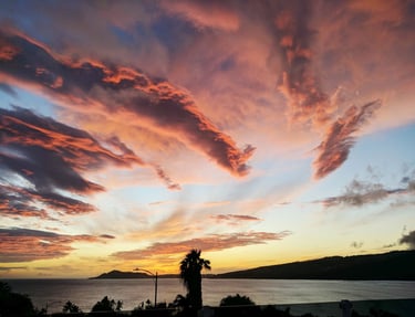 Photo of clouds resembling dragons at sunset