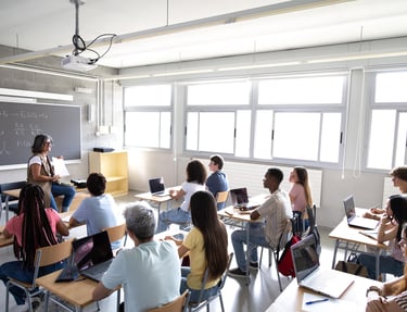 a classroom with a teacher and students in a classroom
