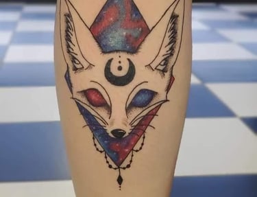 a tattoo style fox head with a triangle jewel chains on it