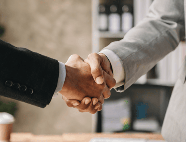 Executives are shaking hands
