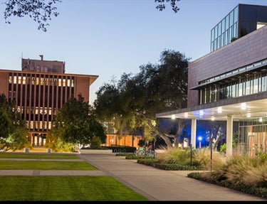a building with a clock tower in the background