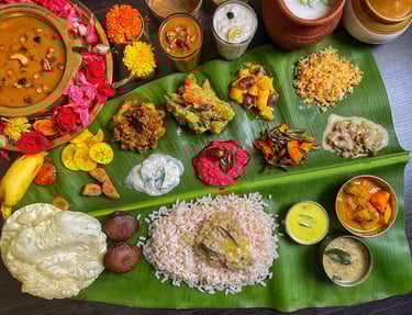 A full Kerala Sadhya featuring 20–28 vegetarian dishes.