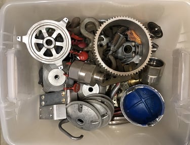 Metal parts in a sculptor's workshop bin, image 13.