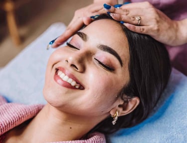 a woman getting her facial massage on the face