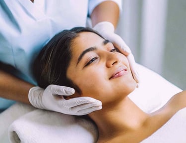 a woman getting a facial lift from a beautician
