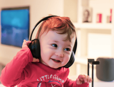small child enjoying music therapy