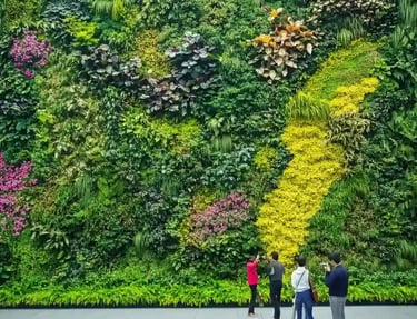 A lush, vibrant vertical garden on a modern building wall 16 * 9