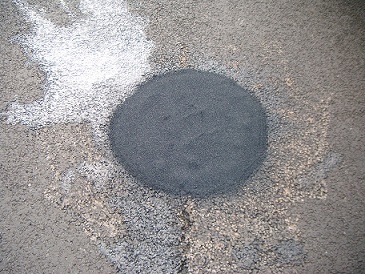a pothole doctor heat repair on a road 