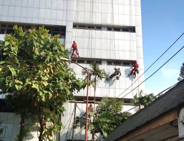 a man on a ladder in a building