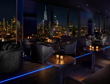 The Roof at PUBLIC Hotel – Stylish rooftop bar with NYC skyline views.