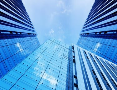 a blue sky with clouds and a few clouds in the background