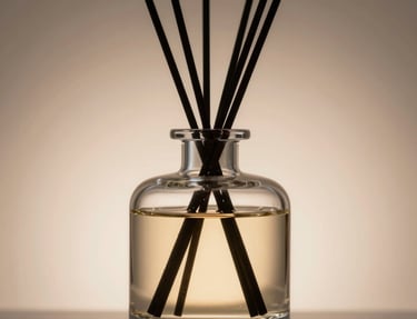 A sleek black and gold signature scent bottle elegantly displayed on a marble surface with soft ambient lighting.
