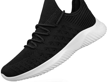 a black and white sneakers with a white sole sole