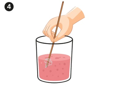 stirring strawberry juice