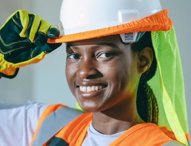 A service business tech smiling while working on a jobsite Photo by Kindel Media
