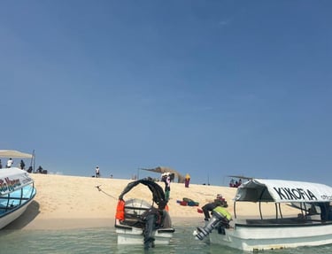 Boat docked at Nakupenda Sandbank with stunning turquoise waters and tropical beach views in Zanzibar, Tanzania