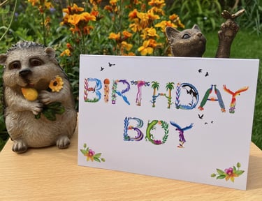 A greeting card with the words Birthday Boy printed in tropical exotic word art