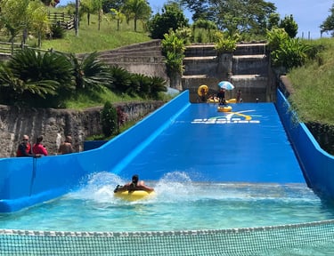 a person on a surfboard in a pool