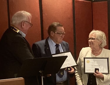 2024-25 President Keith presents Past President Rod and wife Annette with Paul Harris Fellow awards