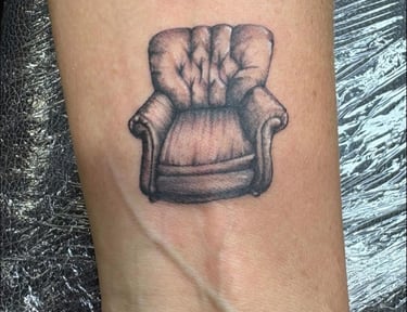 a tattoo of a chair tattoo on arm